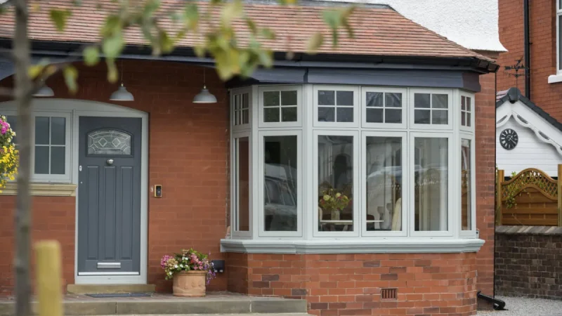 White uPVC bow window with secure locking features.