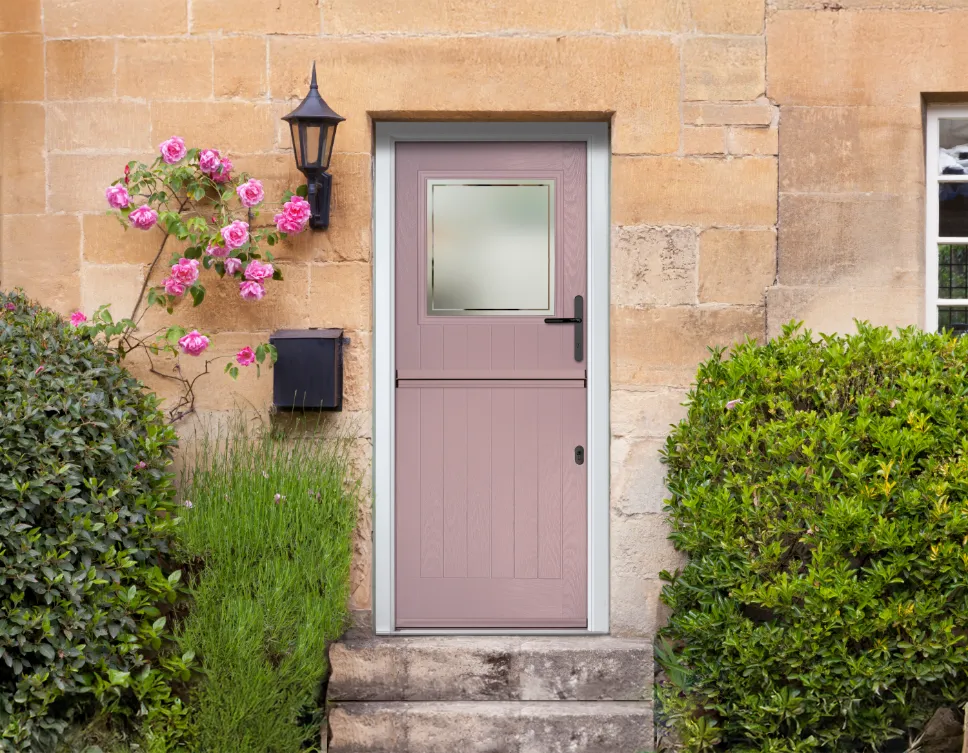 Closed pink stable door seen from outside