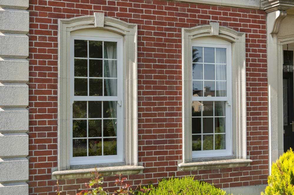 sliding sash windows with ornate surround