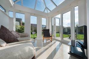 internal view of Edwardian conservatory with sofa and seating