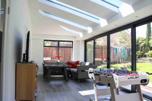 internal view of a lean-to conservatory Yorkshire with a table football table and sofa