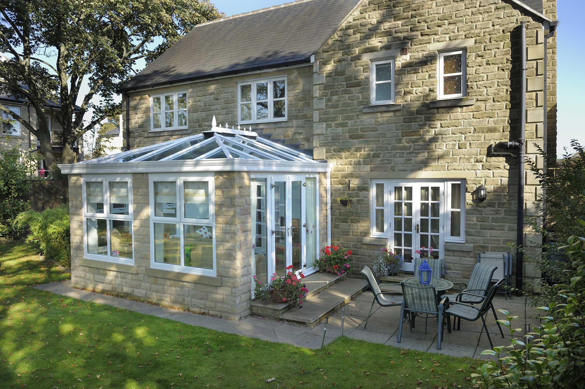orangeries otley with windows and patio doors in stone house